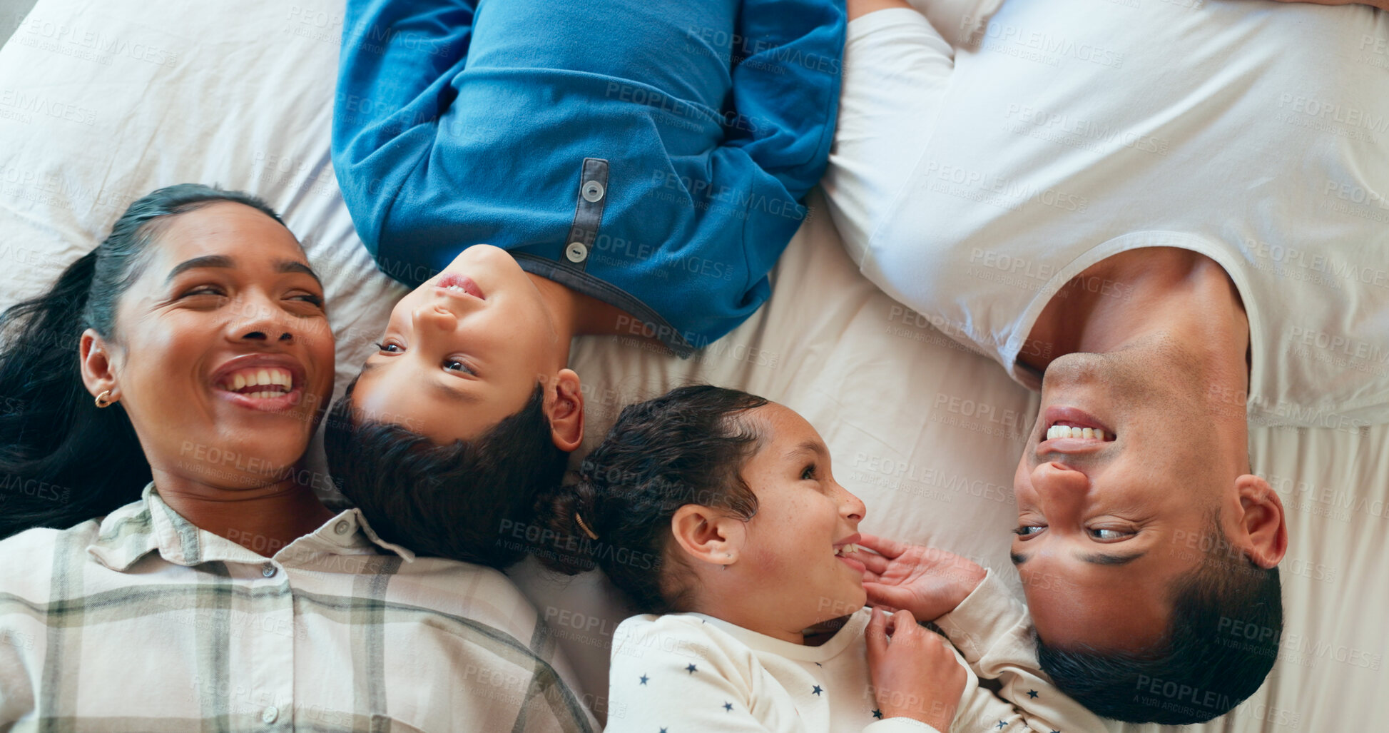 Buy stock photo Happy, bed and above of parents with children for bonding, relax and enjoy morning together. Family, laughing and mother, father and kids in bedroom for love, care and playful on weekend in home