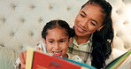 Reading, mother and daughter in bedroom with book, teaching and happy learning time in family home. Knowledge, fantasy and storytelling, mom and child relax on bed together with love, care and story.