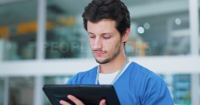 Doctor, man and tablet for reading at hospital in corridor for typing, application or thinking for telehealth. Surgeon, nurse and person on digital touchscreen for medical review, report or history
