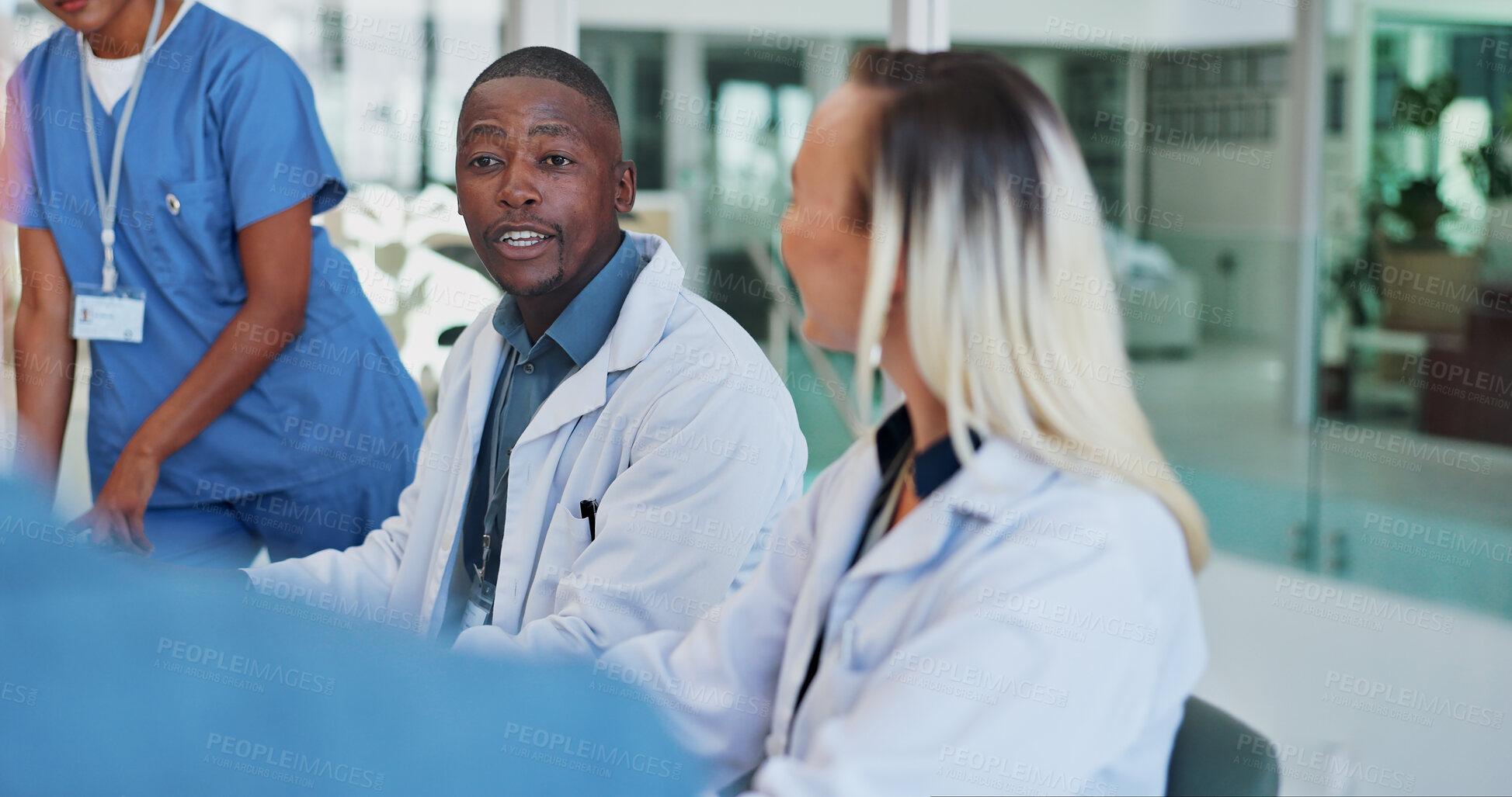 Buy stock photo Doctor, team and man in discussion in conference room with technology, healthcare and happy in meeting. Collaboration, medical and nurse group in boardroom for anti aging treatment and health review
