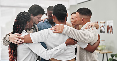 Group therapy, people and hug with support for mental health with kindness, solidarity and trust. Psychology, men and women together with embrace for connection for trauma recovery at consultation