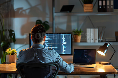 Man, computer and web designer in office at night, programmer and cybersecurity for startup company. Male person, back and writing code on website or app, developer and internet for cpu system on pc