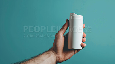 Hand, product and skincare bottle in studio on blue background for beauty, cosmetics or mockup space. Fingers, dermatology and facial acne care or anti aging solution, hyperpigmentation or pimples