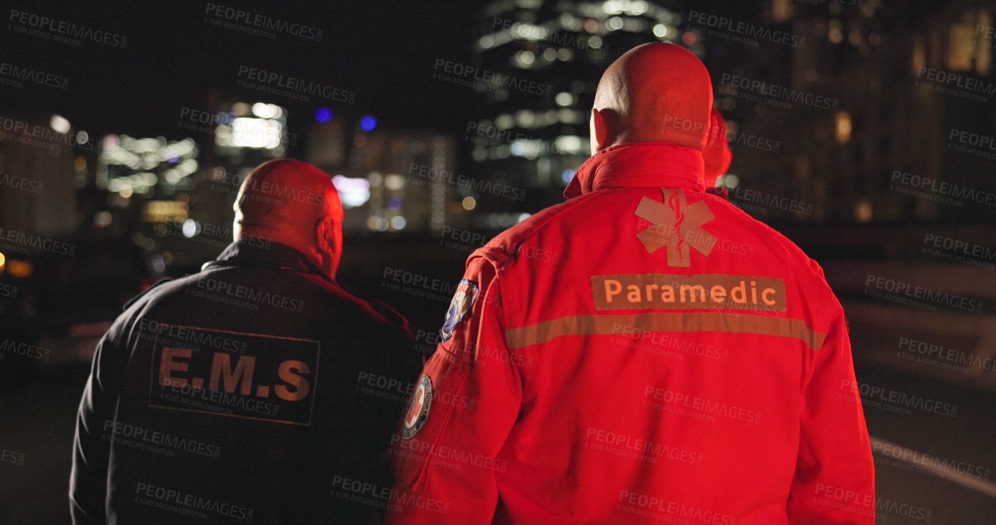 Buy stock photo Back, man and paramedic walking to ambulance for emergency, ems service and healthcare in city. Rear view, medical professional and doctor outdoor at night for first aid, rescue operation and work