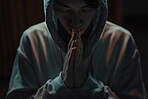 Trust, christian and praying man in dark background with faith, hope and gratitude with prayer. Religion, male person and hands together to seek guidance, wisdom or blessings for personal growth