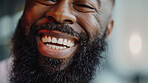 Black, man and beard with smile in portrait with closeup for laughing with confidence in salon with clear skin. Barber, shop and pride with face for cosmetic with hair care, cleaning and teeth