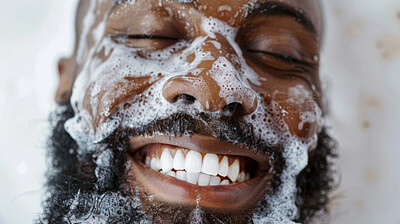 Soap, face and black man with smile, water and hygiene in bathroom of house, relax and happiness. Home, bath and male person with beard, shower and clean, skin and body for health and self care