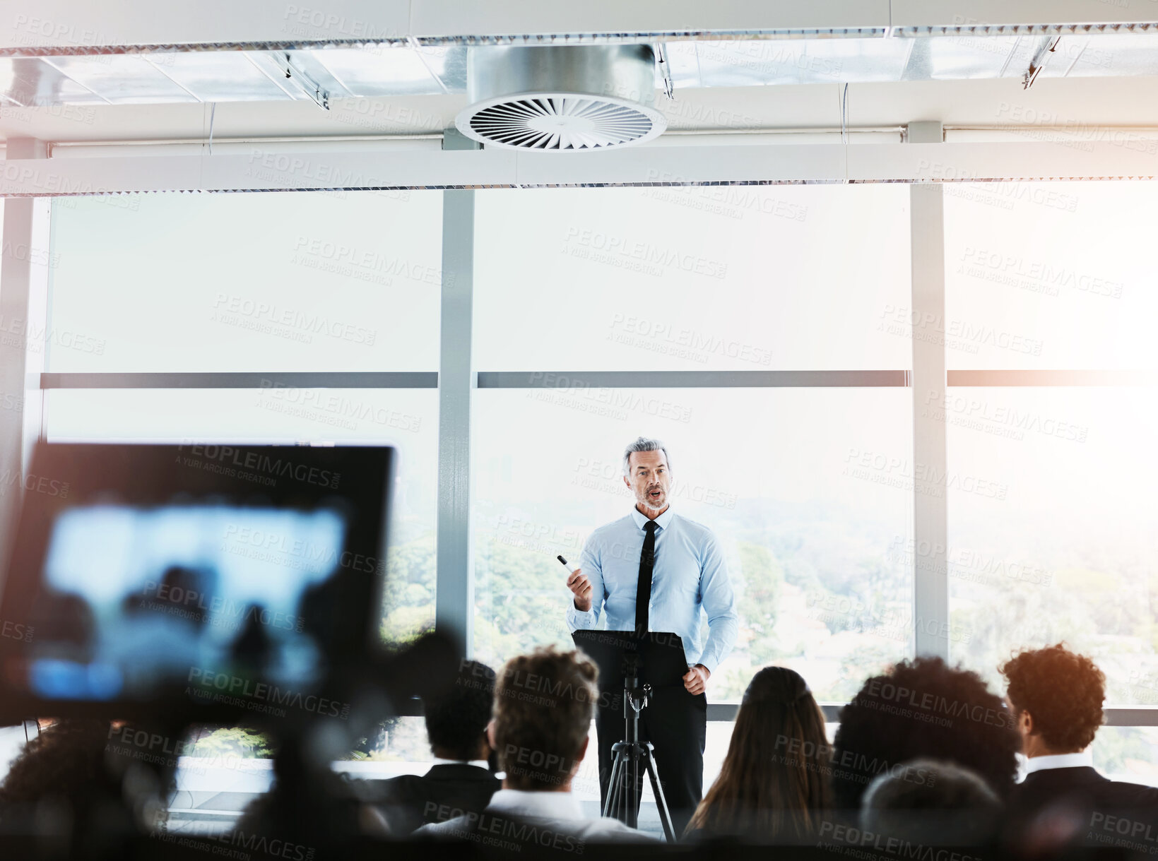 Buy stock photo Presentation, conference speaker and man with business people on stage for discussion, meeting and speech. Entrepreneurship, audience and men and women in seminar, tradeshow and convention event