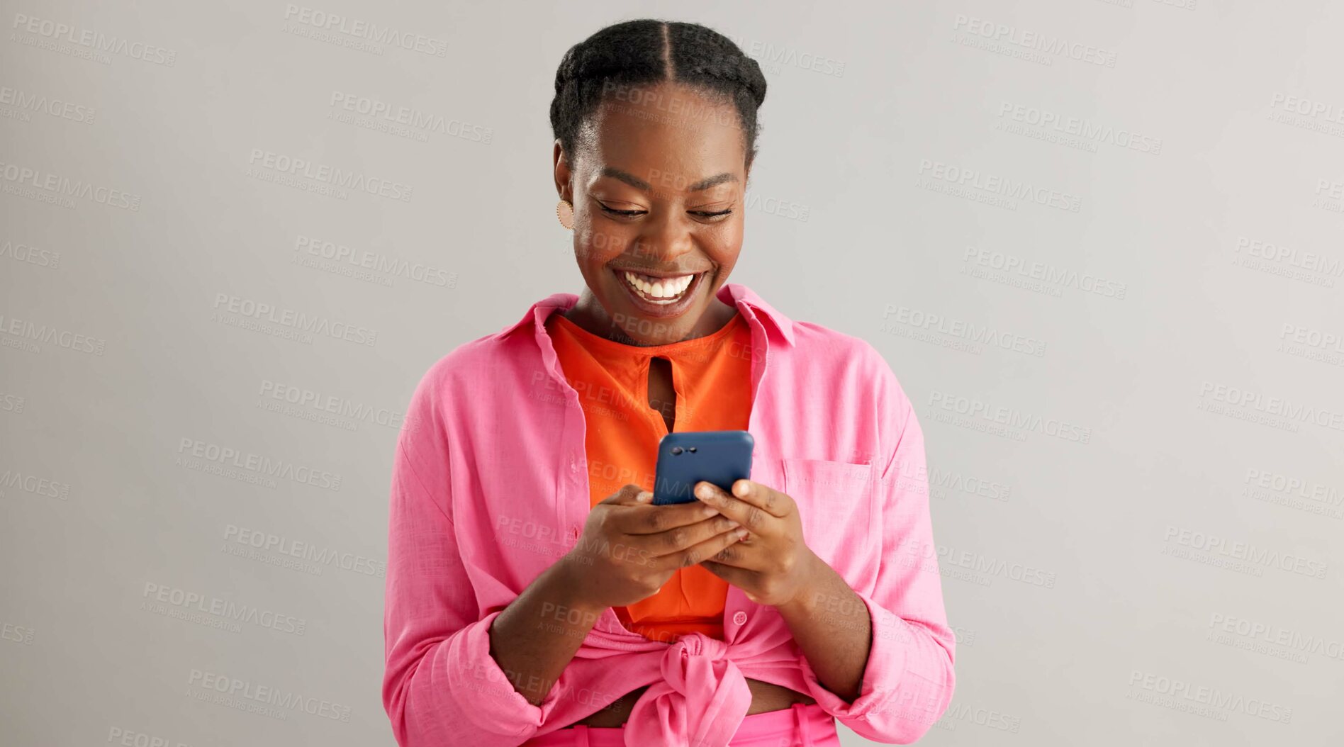 Buy stock photo Wow, news and excited black woman with phone in studio for online competition giveaway on grey background. Yes, smartphone and happy female model with app notification of sign ups winner or prize