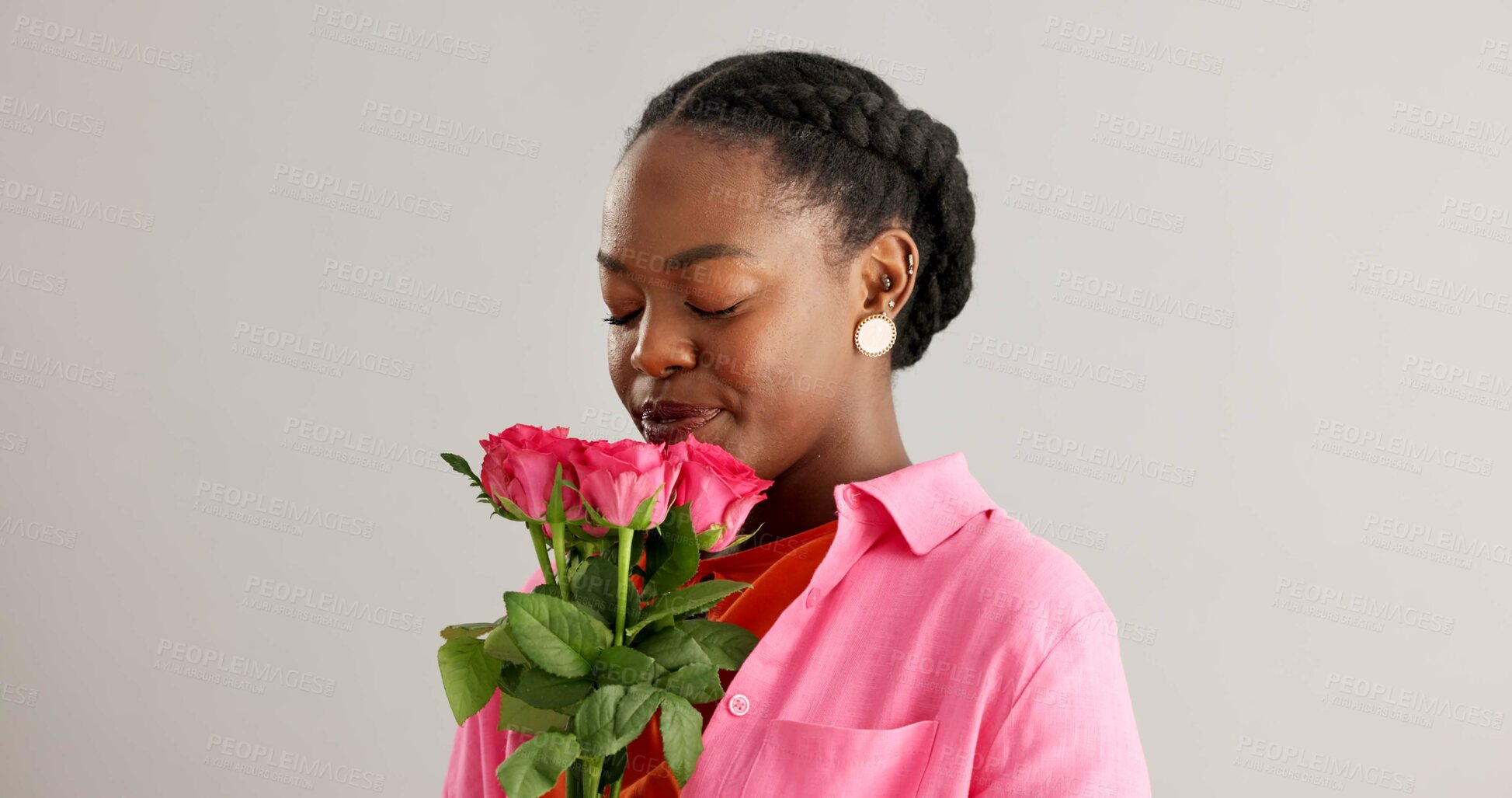 Buy stock photo Woman, happy and pink flowers in studio for gift, kindness and gratitude with scent or fragrance on a white background. Face of an African person or model with bouquet of roses for valentines day