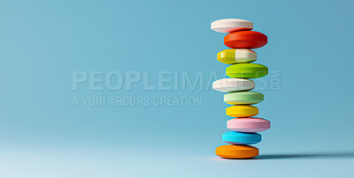 Medication, healthcare and stack of pills in studio for life extension drugs, healing or recovery. Color, medical and line of tablets or medicine for weightloss by blue background with mockup space.