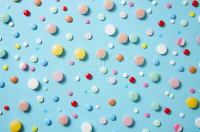 Pills, medical and tablets with color, vitamins and healthcare on a blue studio background. Overdose, addiction awareness and pharmaceutical drugs with supplements and antibiotics with painkiller