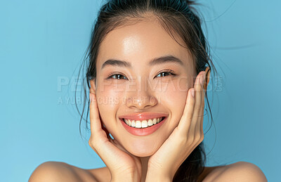 Buy stock photo Asian, woman and hands on face for beauty, skincare glow and dermatology on blue background. Healthy skin, antiaging treatment or facial wellness, natural cosmetics and clean look makeup in portrait