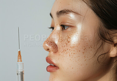 Skincare, needle and Asian woman in studio with cosmetic collagen filler for facial hydrate routine. Health, botox and female person with facial dermatology injection for treatment by gray background