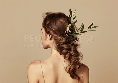 Back, plant and woman with hair care, beauty and natural treatment on beige studio background. Rear view, branch and model with mockup space or grooming for shine, glow or texture with organic growth