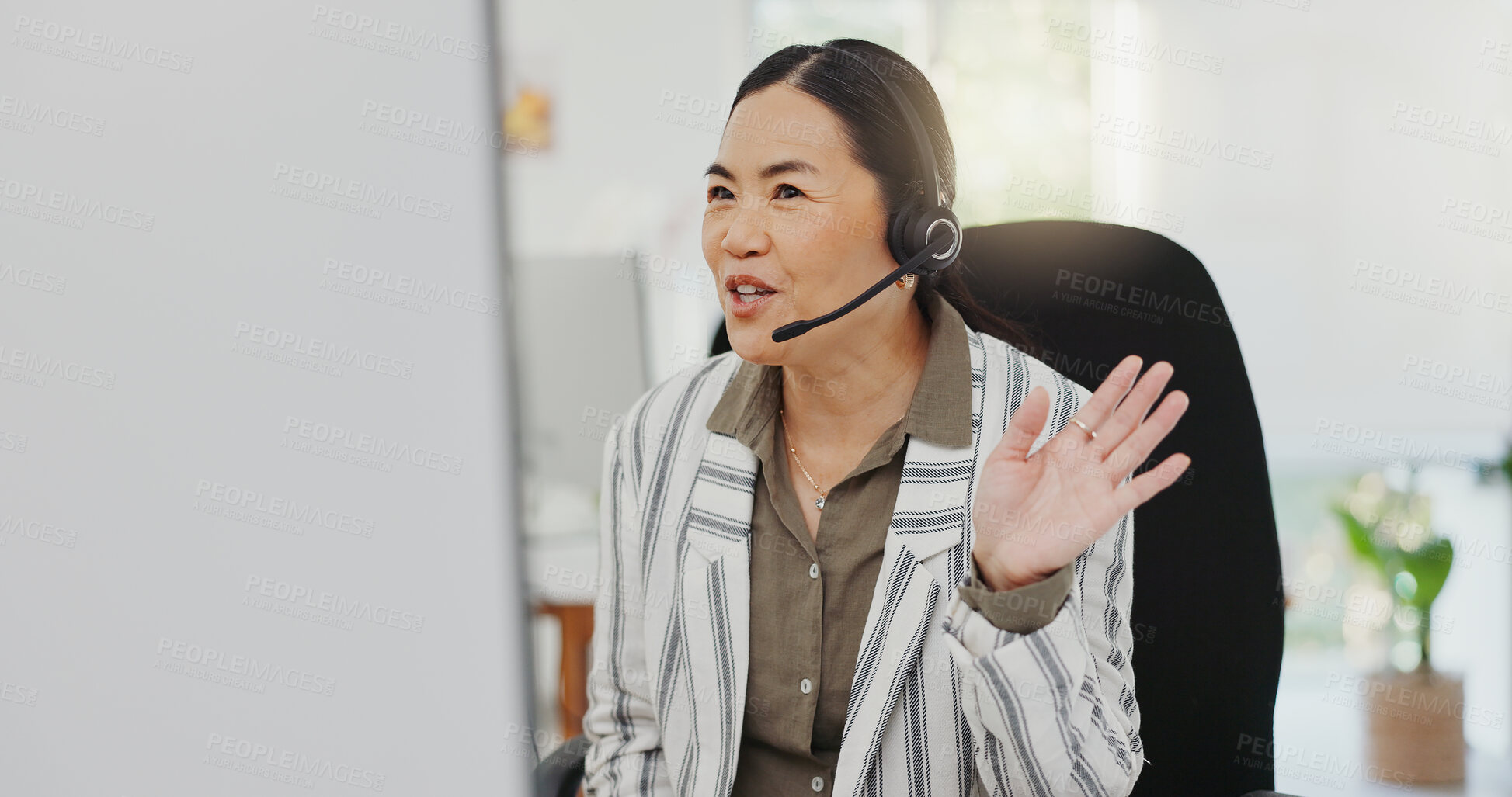 Buy stock photo Asian woman, call center and wave in virtual meeting, discussion or customer service at the office. Friendly female person, consultant or agent talking on computer in hello for webinar at workplace