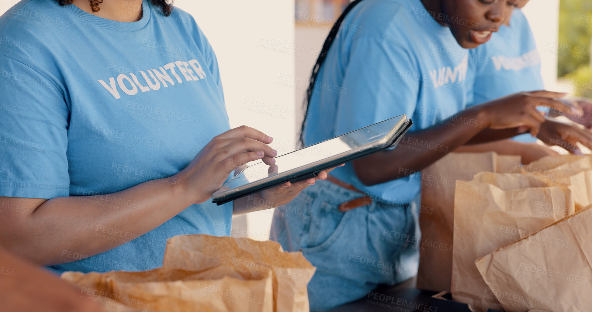 Buy stock photo People volunteering, tablet and food donation in community service, poverty support and NGO checklist. Nonprofit, hands or group packaging groceries, planning package or helping for charity project