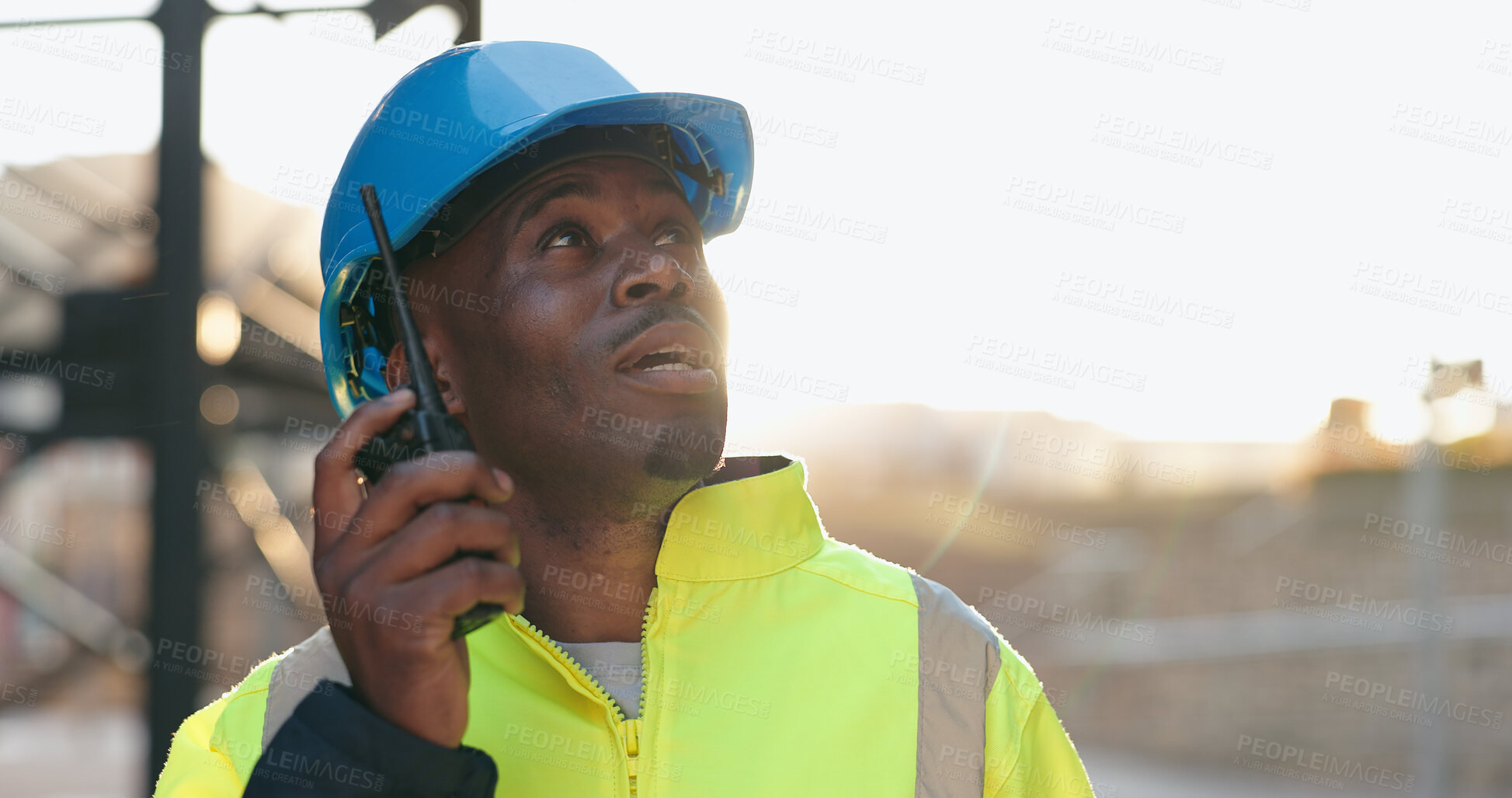 Buy stock photo Walkie talkie, engineering and man construction worker on site for inspection with communication. Quality check, architecture and African male industry foreman with radio for project management.