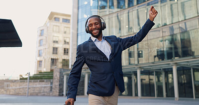 Business man, dancing and headphones in city with smile, steps and spin with bag for commute by office buildings. Person, employee or excited dancer with music, briefcase or outdoor on metro sidewalk