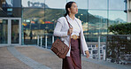 Japanese business woman, walking and street by office buildings with thinking, direction and bag in city. Person, outdoor and search for location with idea, memory or vision for career on metro road