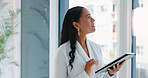 Business woman, tablet and reading in hallway at modern office with communication, vision and networking. Person, touchscreen and typing with thinking, application and problem solving in workplace