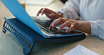 Hands, typing and laptop on workstation in office, productivity and online research or planning a project. Business person, writing and editor of company website or blog and creativity on computer