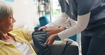 Woman, nurse and patient with blood pressure machine for heart rate or monitoring pulse at hospital. Hands of scrub with arm strap on senior person for healthcare, checkup or examination at clinic