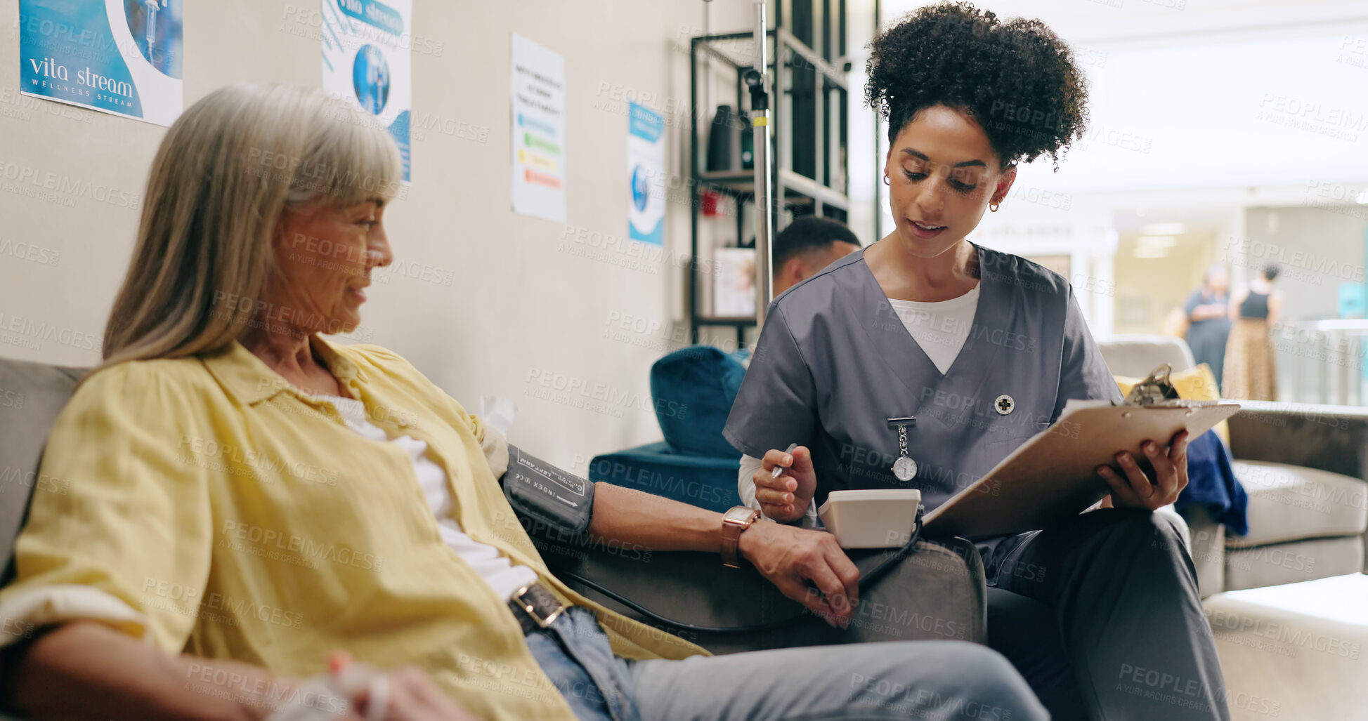 Buy stock photo Woman, nurse and clinic with iv drip at with notes, clipboard or review with chat for wellness. Elderly patient, person and medical employee with paperwork, results and report on checklist for health