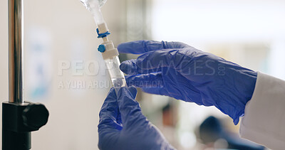 Hospital, IV drip and hands of nurse with liquid for medicine, infusion and medication dose for patient. Healthcare, clinic and closeup of doctor with fluid for treatment, sickness and medical care