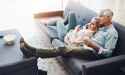 Buy stock photo Wine, love and mature couple on sofa watch movie on television together for at home date. Relax, popcorn and senior man and woman in living room streaming film, show or video with glass of champagne.