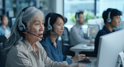Senior woman, call center and group at office for telemarketing with headphones, mic and contact us for advice. Chinese consultant, agent and people with ideas, customer care and service in Shanghai