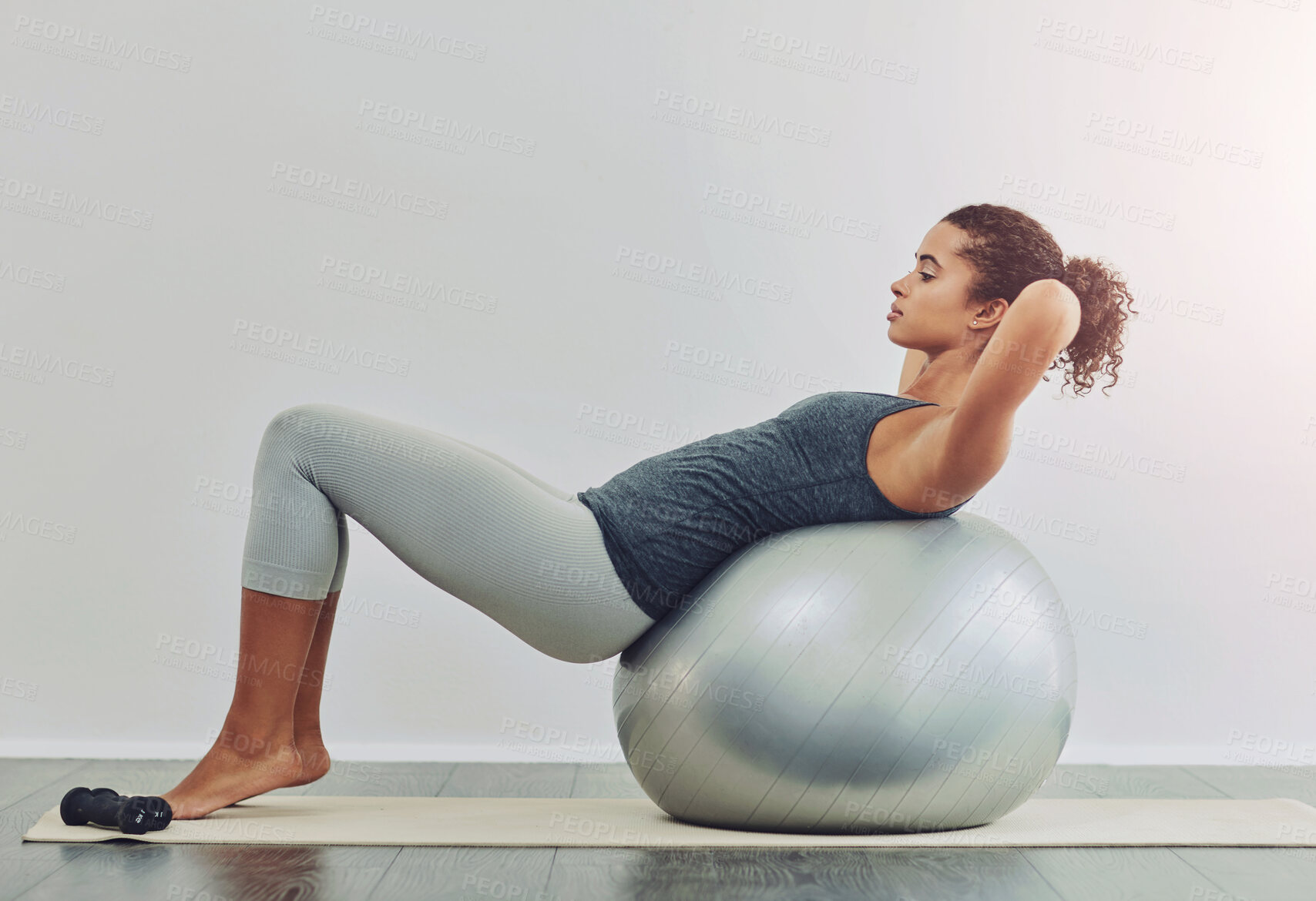 Buy stock photo Ball, fitness and sit up with woman in studio on white background for core strength, wellness or workout. Exercise, training and profile of person with equipment for balance, health or stability