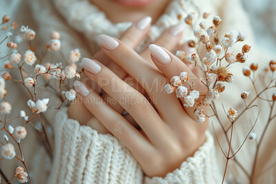 Woman, hands and flowers in closeup with nature for art, beauty and natural in winter. Female person and fingers with floral or plant in zoom, sustainable fashion or eco friendly and accountability