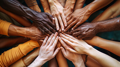 People, diversity and hands together with team for unity, solidarity or community above. Top view of diverse group piling for equality, support or about us in difference for hope or human interaction