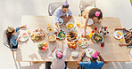 Happy family, above and birthday party in garden with love, sharing and eating to bond together for lunch. Generations, kids or celebrate by food on green backyard, nutrition and roast meat on table