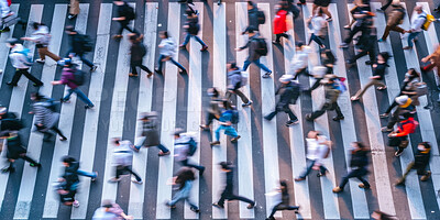 Crosswalk, motion blur and pedestrian crowd in city for morning rush hour commute from above. Hurry, road or travel with group of men and women outdoor in town for crossing street at start of day