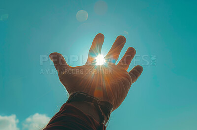 Faith, hand and sunshine on blue sky for religion, hope and inspiration for spiritual support. God, heaven and person with reach in sun light for worship, care and gratitude prayer for soul wellness.