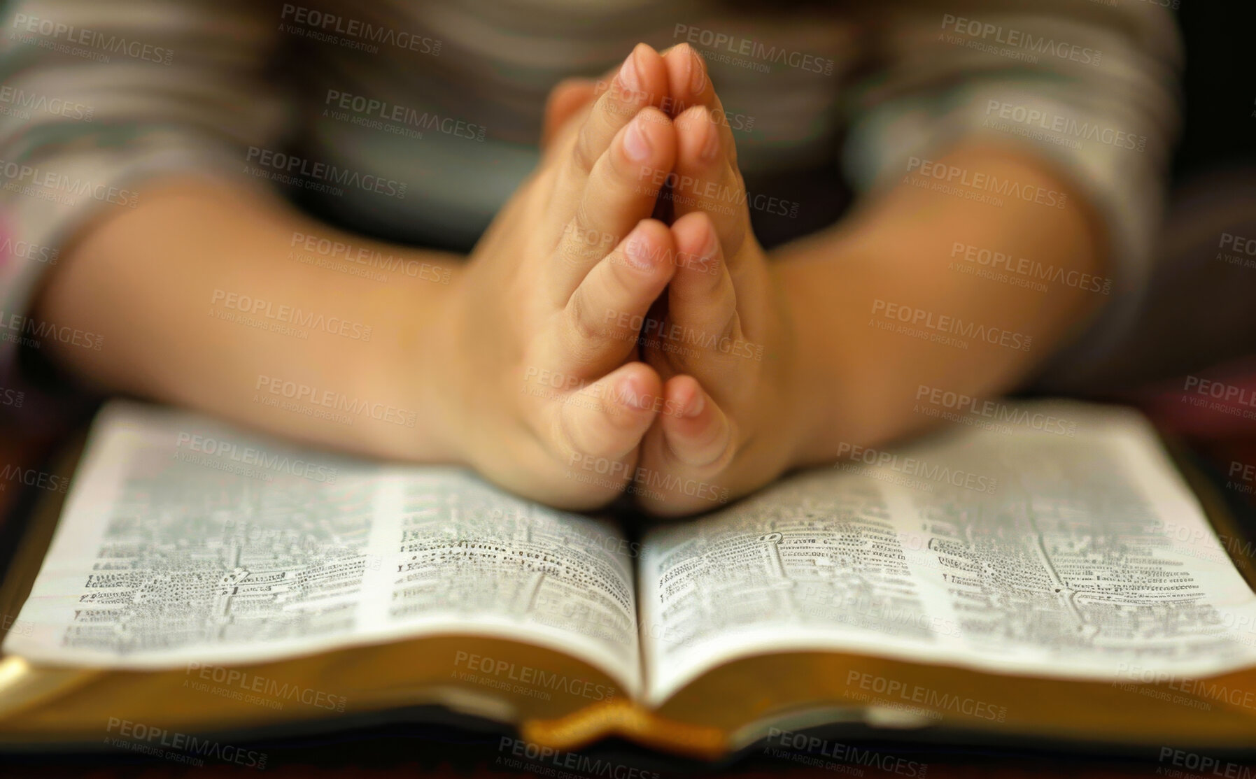 Buy stock photo Prayer, trust and child with hands on bible in home for hope, thanks and gratitude to God in gospel. Praise, worship and kid with holy book, spiritual respect and study with Christian religion 