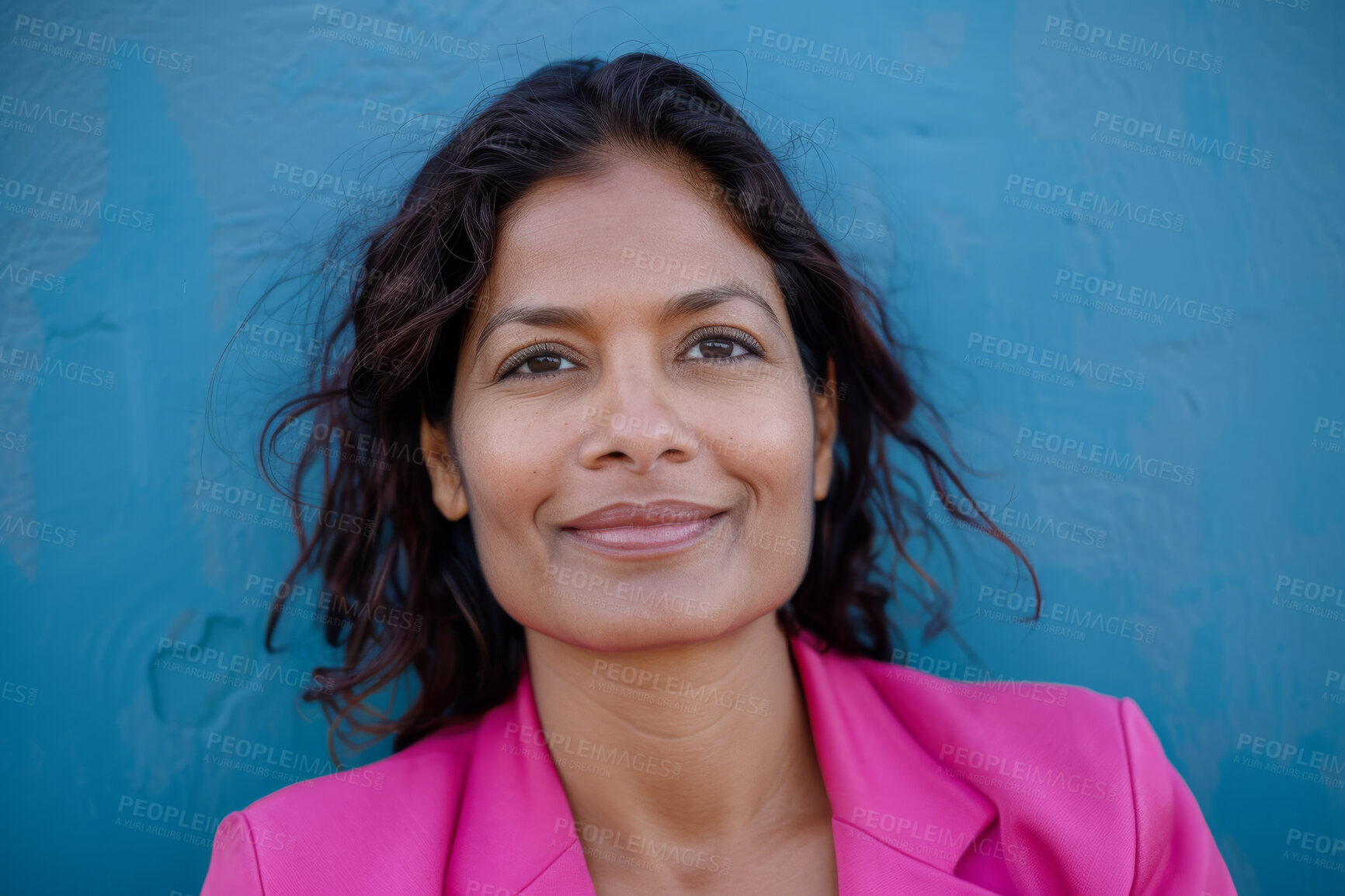 Buy stock photo Indian woman, portrait and employee in studio, smile and work pride on blue background. Female person, entrepreneur and mockup space for attorney, confident lawyer and career opportunity at law firm