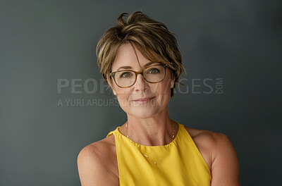 Glasses, portrait and mature executive assistant in studio on gray background for administration. Confident, corporate and face with professional business woman at work for company mission or vision