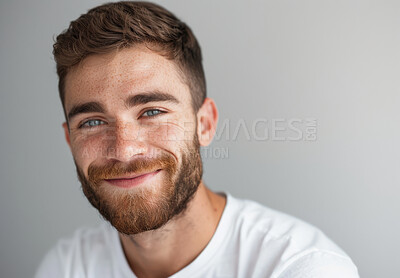 Buy stock photo Man, portrait and studio with smile, beard and confidence isolated on white background. Model, freckles and satisfaction with skincare, glow and grooming treatment for cosmetic dermatology or hygiene