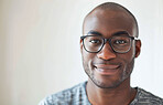 Smile, glasses and portrait of black man in studio with positive, good and confident attitude from Nigeria. Happy, vision and male person with spectacles isolated by white background with mockup.