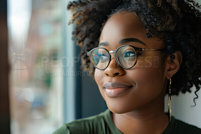 Black woman, thinking and afro with glasses by window for career ambition, vision or business at office. Face of African, female person or employee with smile in wonder or thought for reflection