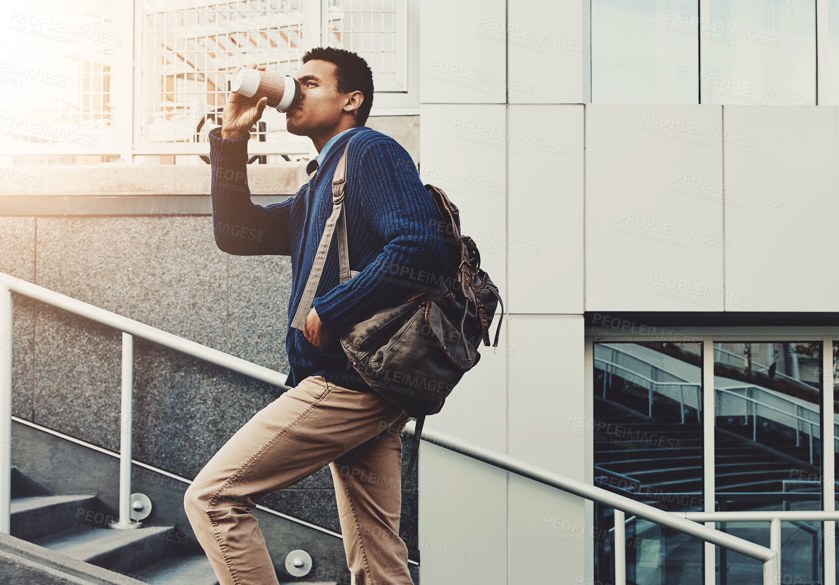 Buy stock photo Coffee, walking and businessman on stairs in city with backpack for travel to airport for work trip. Career, steps and male corporate lawyer drinking caffeine latte in town for commuting to office.