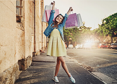 Buy stock photo Excited, portrait and woman with bags from shopping, retail therapy and sale in the city. Smile, freedom and a young lady with happiness from fashion deal, sales and winning with a spree in town