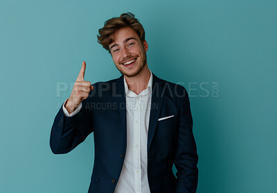 Businessman, pointing and smile by studio background for advertising, product placement and notification for sale. Portrait, happy man and space for showing info with marketing and offer on mockup