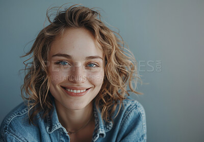 Happy woman, beauty and smile in portrait with mockup space isolated in gray background. Female person or model and face with casual clothes for fashion, makeup and cosmetics with skin care treatment