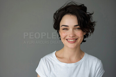 Portrait, beauty and smile of woman in studio isolated on gray background mockup space. Face, happy and model in casual clothes for fashion, skin makeup or cosmetics of stylish hairdresser in Spain
