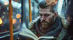 Man, railway and reading with book at night for knowledge, story or literature in train, travel or subway station. Male person and novel for information or learning language in commute or immigration