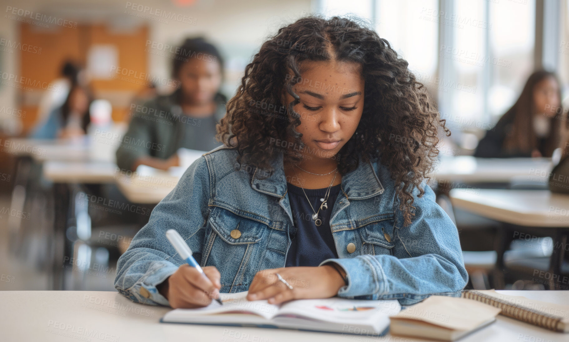 Buy stock photo Girl, student and book in school or desk, learning institute and children in education class. Study textbook, serious and development or growth with pen for notes, female person and high school